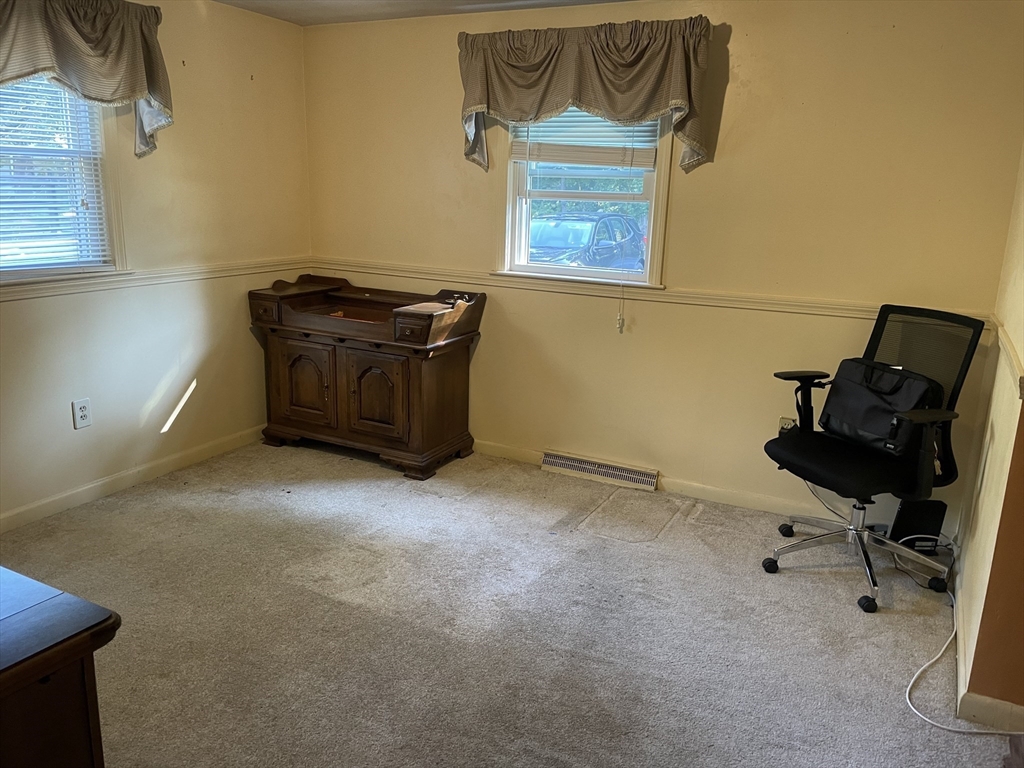 75 Lexington Road Billerica, MA 01821 - Photo 10 of 25 a room with a desk and a chair