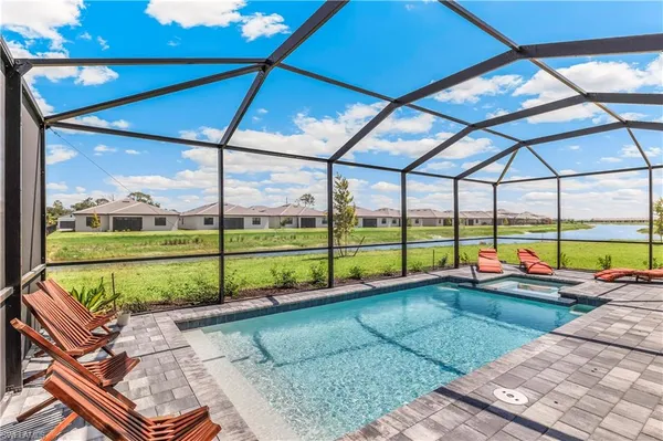 a view of a backyard with swimming pool