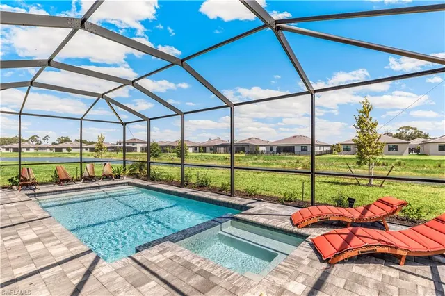 a view of a patio with a table chairs