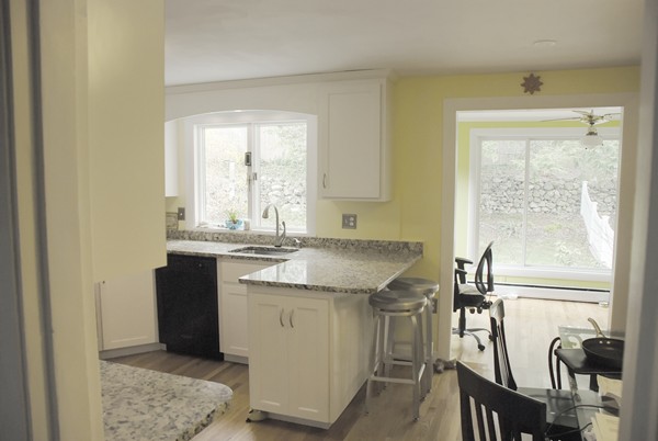 37 Webster Road Lexington, MA 02421 - Photo 7 of 11 a kitchen with a sink stove and cabinets