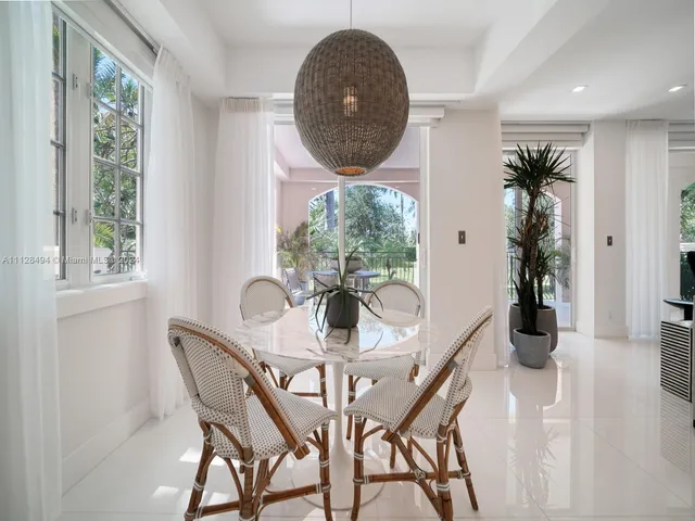 a view of a dining room with furniture and window