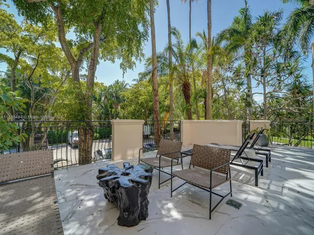 a bedroom with a bed and large window