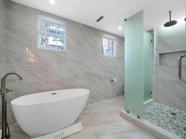 a bedroom with a bed and a lamp