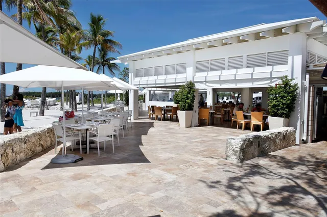 a view of a patio with a table and chairs