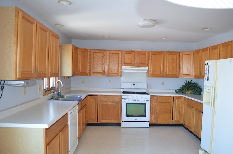 Undisclosed Address Somonauk, IL 60552 - Photo 4 of 25 a kitchen with stainless steel appliances granite countertop a sink stove and refrigerator