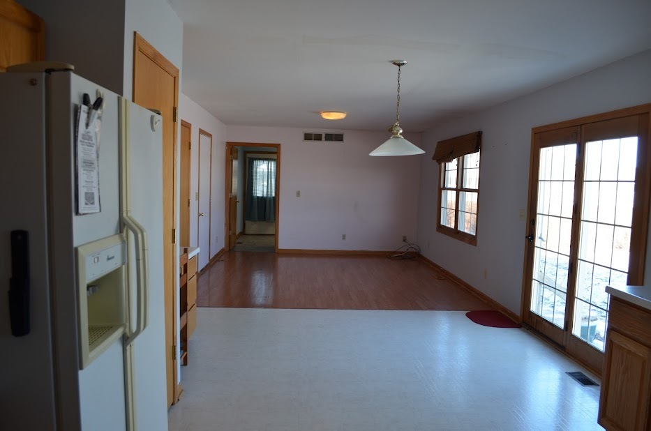 Undisclosed Address Somonauk, IL 60552 - Photo 8 of 25 a view of a hallway with windows and chandelier