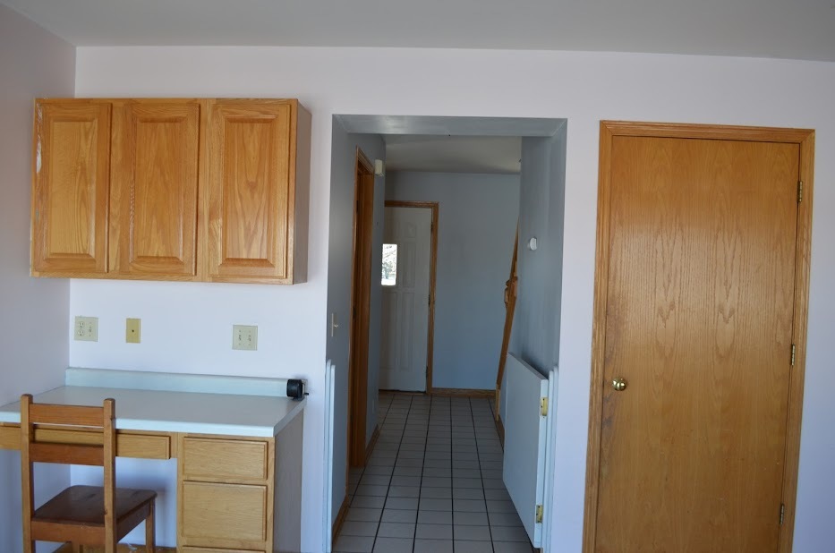Undisclosed Address Somonauk, IL 60552 - Photo 9 of 25 a view of a hallway with wooden floor and a cabinet