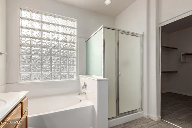 a bathroom with a bathtub and a shower