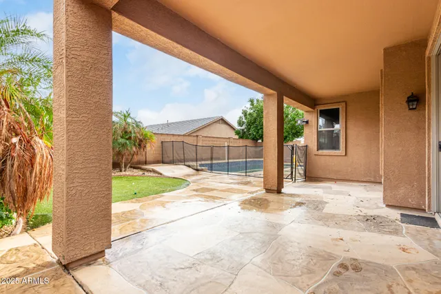 a view of a house with backyard and balcony