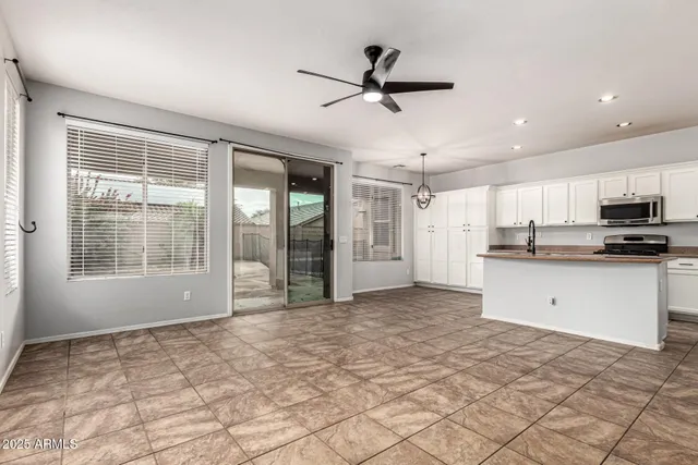 a view of a kitchen with a sink and windows