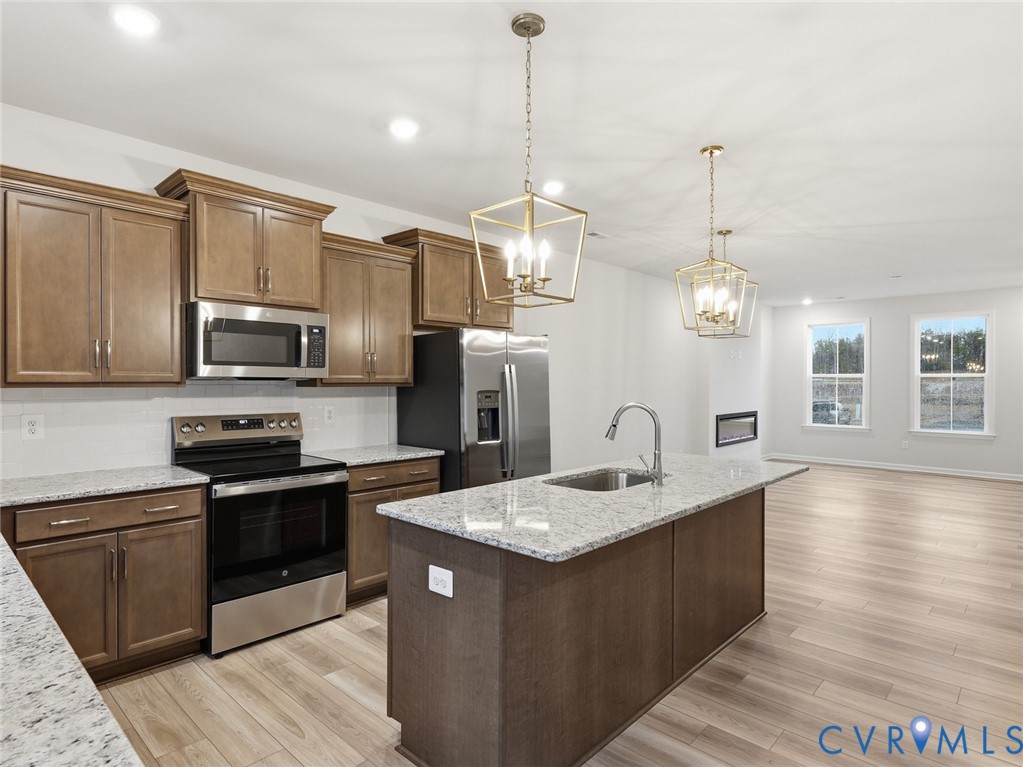 159 Corcoran Way Aylett, VA 23009 - Photo 2 of 20 a kitchen with stainless steel appliances granite countertop a sink a stove top oven and refrigerator