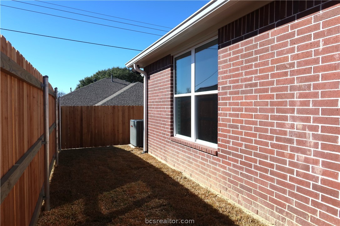 2008 Reagan Court Bryan, TX 77802 - Photo 20 of 21 a view of a brick house with a large window