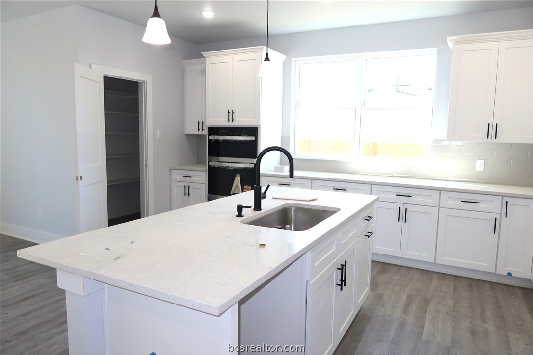 2008 Reagan Court Bryan, TX 77802 - Photo 6 of 21 a kitchen with a sink and a refrigerator