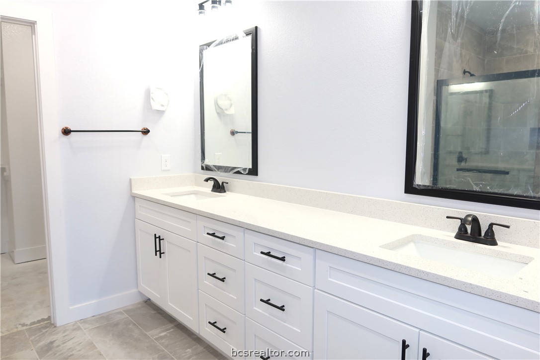 2008 Reagan Court Bryan, TX 77802 - Photo 9 of 21 a bathroom with a sink and a mirror