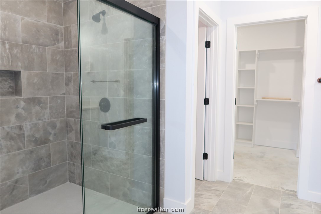 2008 Reagan Court Bryan, TX 77802 - Photo 10 of 21 a bathroom with a glass shower door