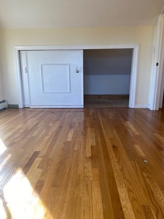 272-2 Nevada Street, Unit 2 Newton, MA 02460 - Photo 18 of 28 a view of empty room with wooden floor