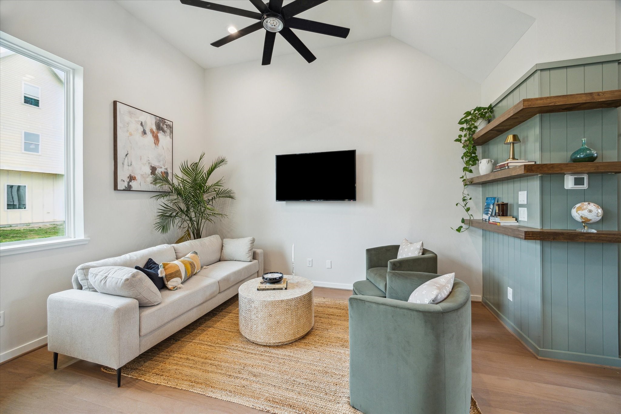 3902 Zina Way Houston, TX 77018 - Photo 13 of 48 a living room with furniture and a flat screen tv