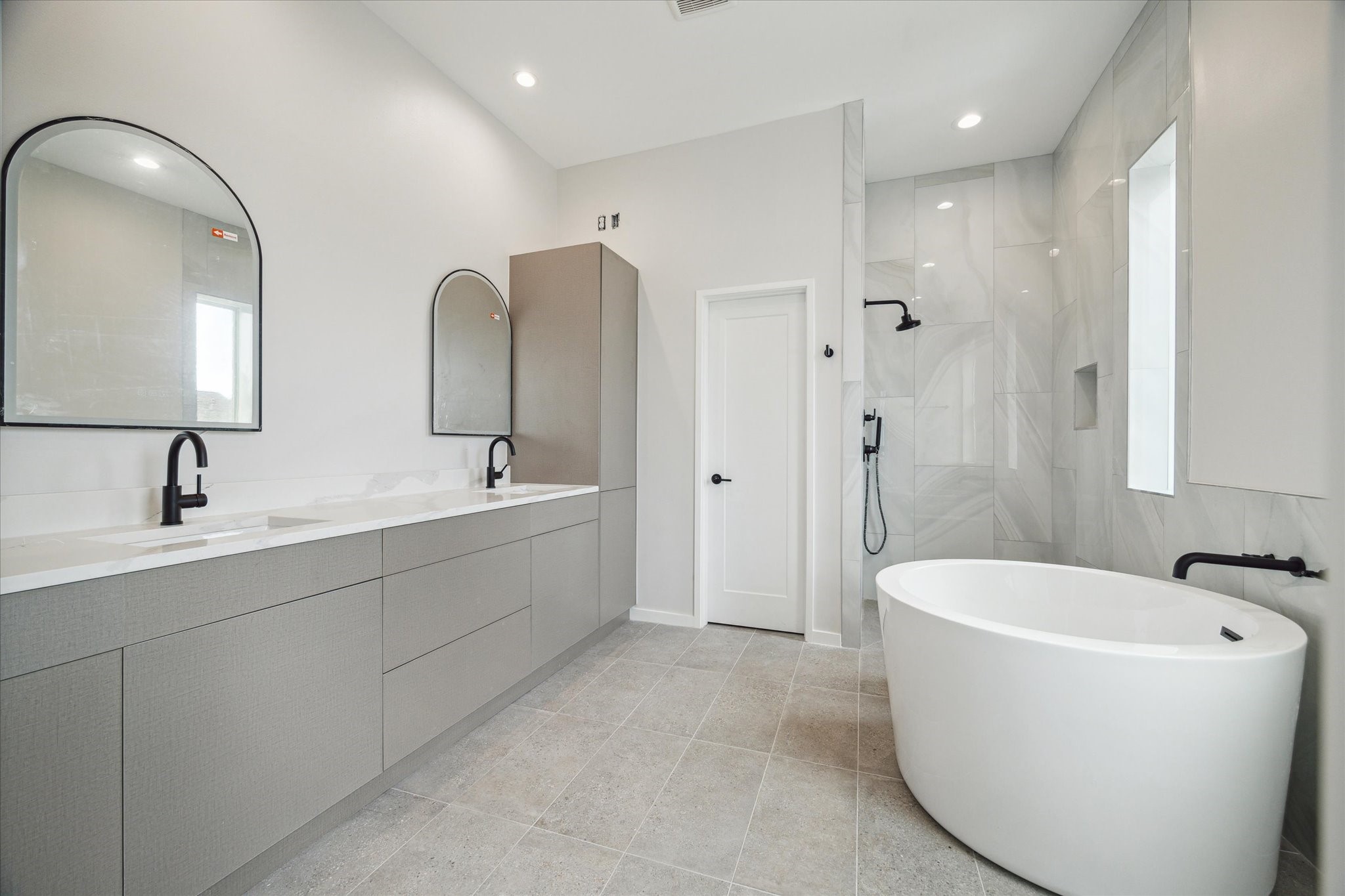 3902 Zina Way Houston, TX 77018 - Photo 15 of 48 a spacious bathroom with a double vanity sink mirror and bathtub
