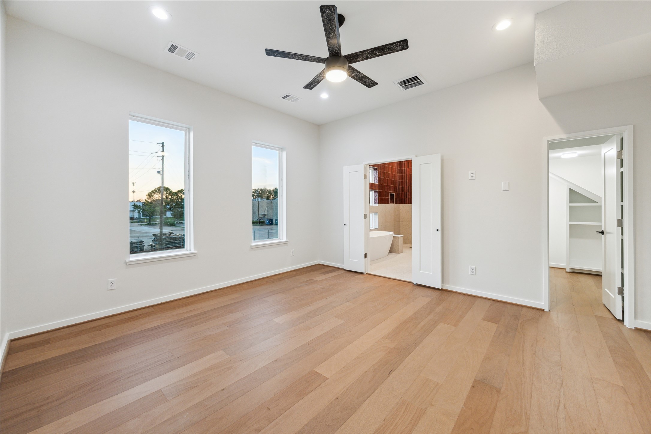3902 Zina Way Houston, TX 77018 - Photo 30 of 48 a view of an empty room with a window and wooden floor