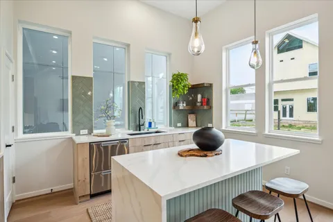 a kitchen that has a stove and a table