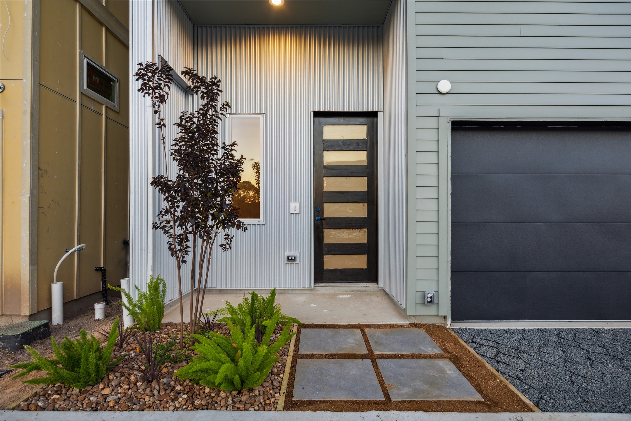 3902 Zina Way Houston, TX 77018 - Photo 45 of 48 a view of a house with a potted plant and floor to ceiling window