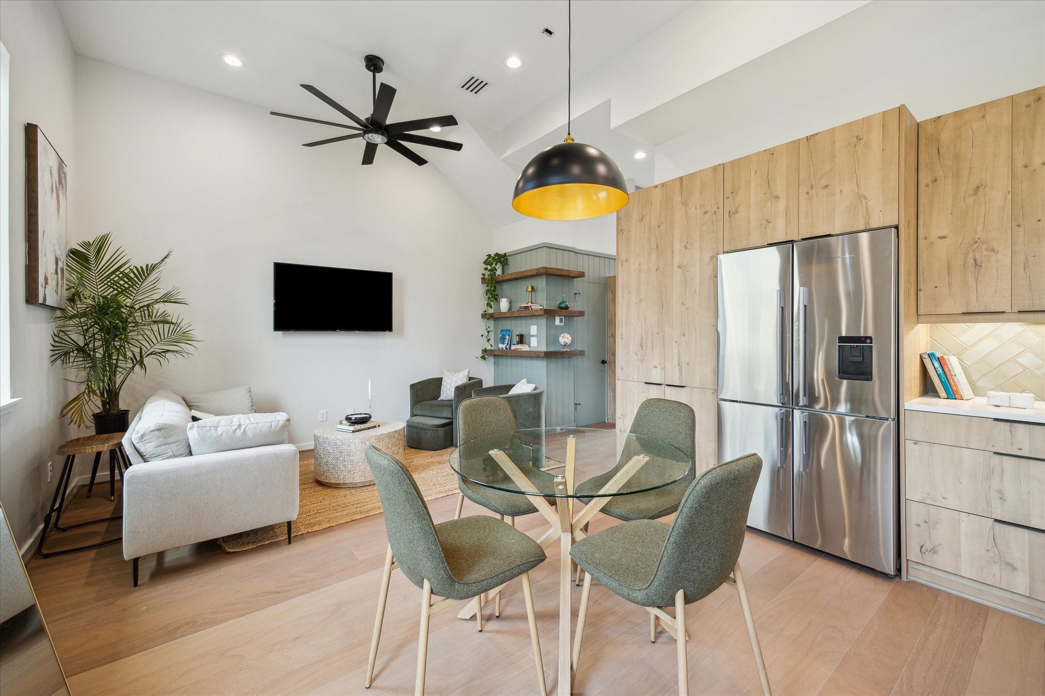 3902 Zina Way Houston, TX 77018 - Photo 6 of 48 a living room with furniture a ceiling fan and a flat screen tv