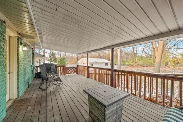 a view of a patio with wooden floor