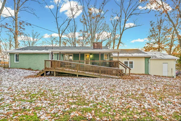 a house with trees in the background