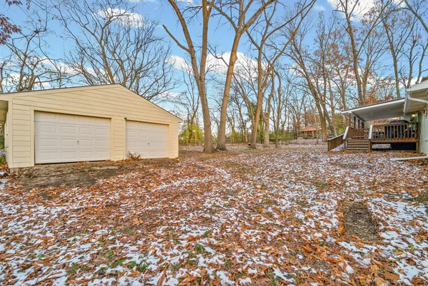 a view of a yard with a house
