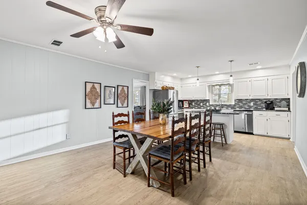 a view of a dining room kitchen and a window