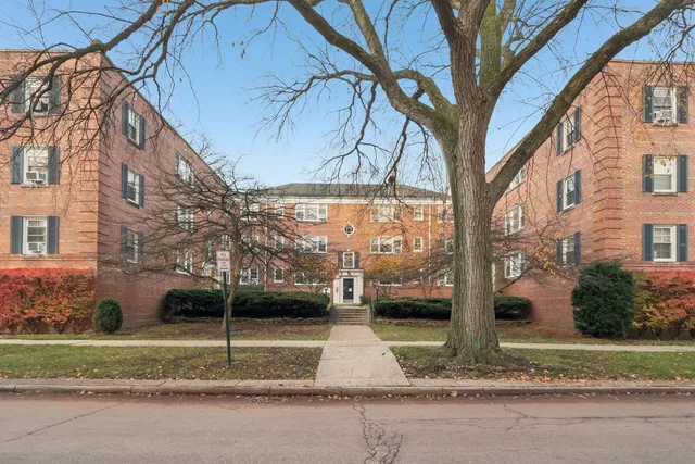 a view of a yard in front of a brick house