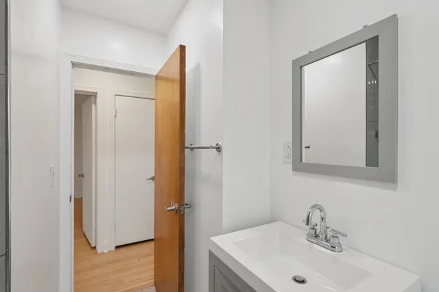 a bathroom with a sink and shower
