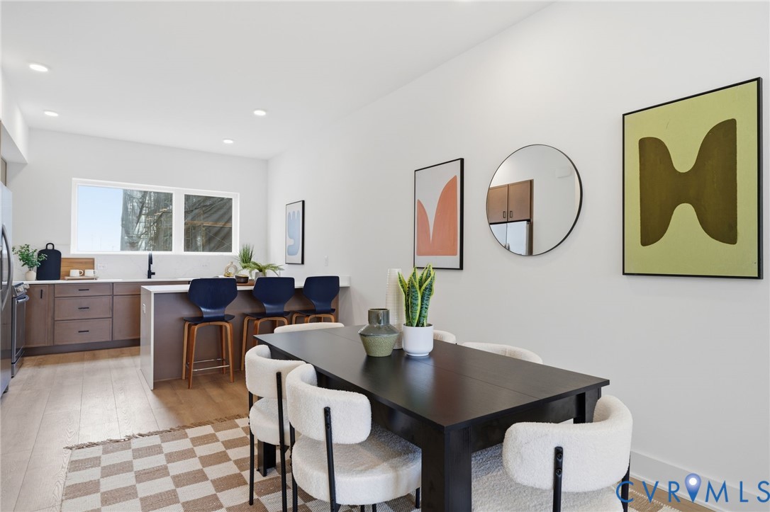 606 Decatur Street Richmond, VA 23224 - Photo 14 of 24 a view of a dining room with furniture and a potted plant