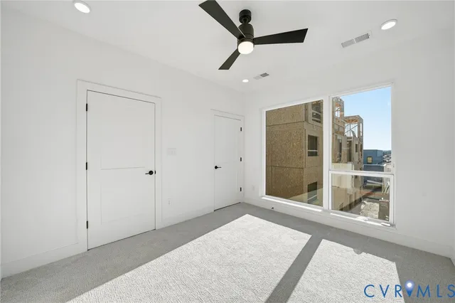 a view of an empty room with a window