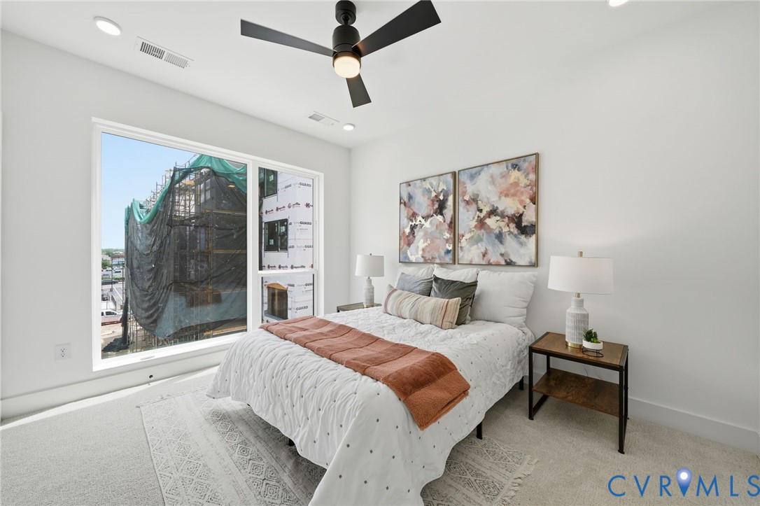 606 Decatur Street Richmond, VA 23224 - Photo 19 of 24 a bedroom with a large bed and a painting on the wall