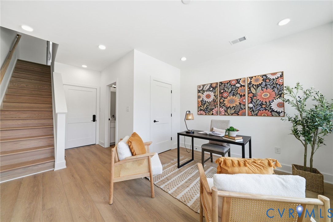 606 Decatur Street Richmond, VA 23224 - Photo 2 of 24 a living room with furniture and wooden floor
