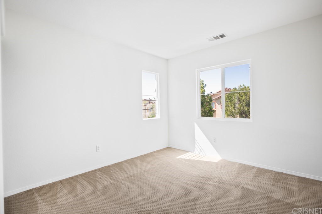 24063 Tango Drive Valencia, CA 91354 - Photo 22 of 46 an empty room with windows
