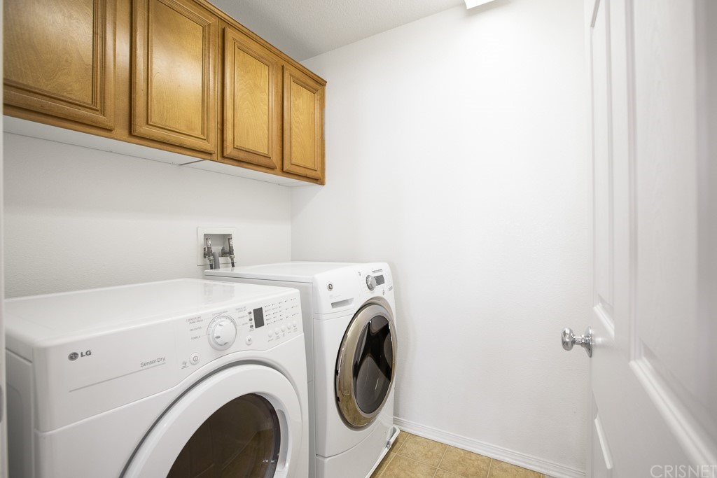 24063 Tango Drive Valencia, CA 91354 - Photo 25 of 46 a utility room with dryer and washer