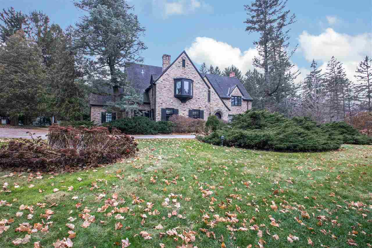311 Spring Creek Road Rockford, IL 61107 - Photo 1 of 25 a front view of a house with a yard and garage