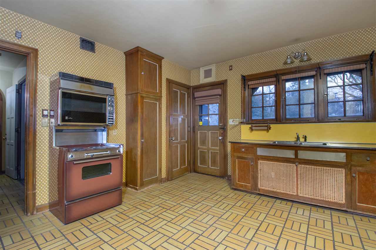 311 Spring Creek Road Rockford, IL 61107 - Photo 11 of 25 a kitchen with stainless steel appliances granite countertop a refrigerator and a stove top oven