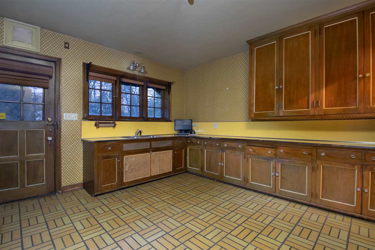 311 Spring Creek Road Rockford, IL 61107 - Photo 12 of 25 a kitchen with stainless steel appliances a stove a sink and a microwave