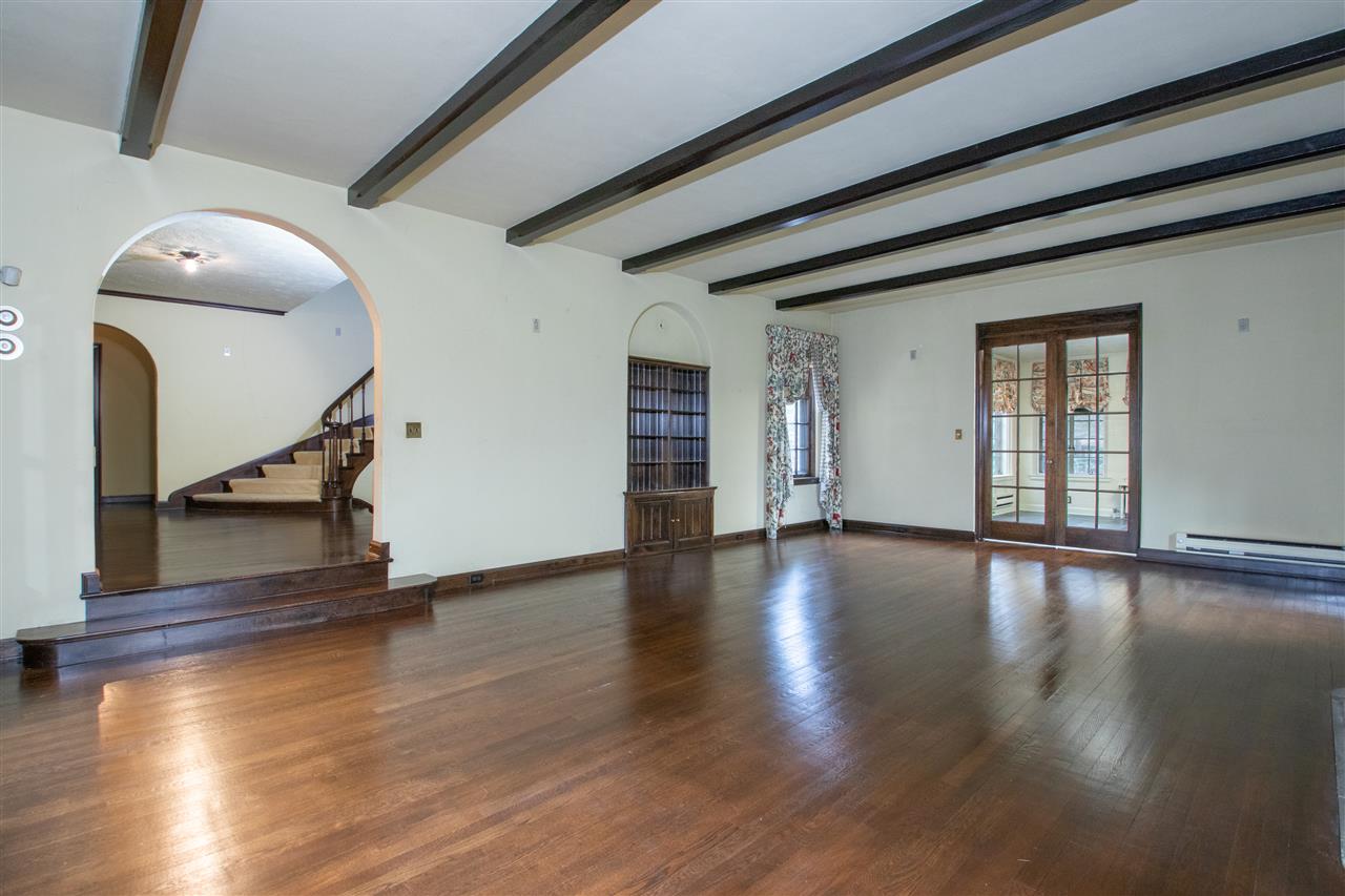 311 Spring Creek Road Rockford, IL 61107 - Photo 7 of 25 a view of an empty room with wooden floor and a window