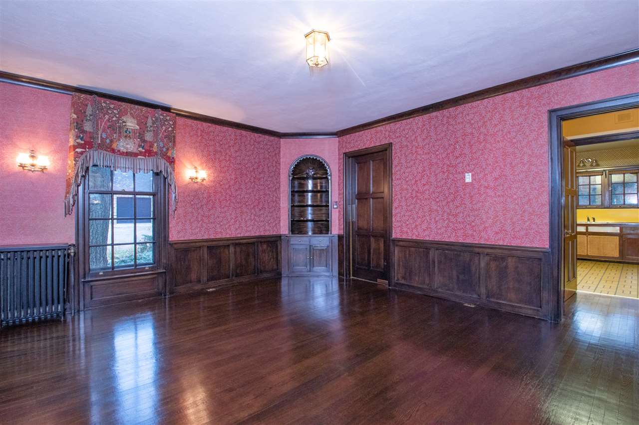 311 Spring Creek Road Rockford, IL 61107 - Photo 10 of 25 a view of empty room with wooden floor and fan