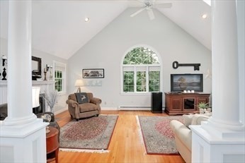 117 Perkins Row Topsfield, MA 01983 - Photo 13 of 25 a living room with furniture large window and flat screen tv