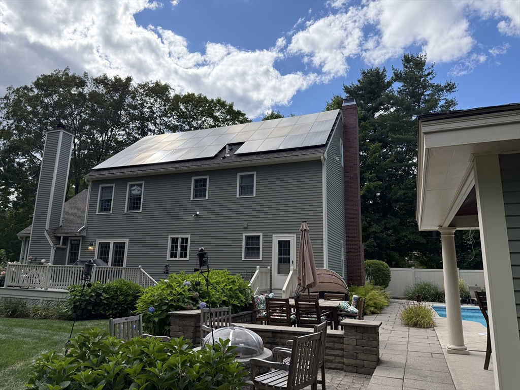117 Perkins Row Topsfield, MA 01983 - Photo 4 of 25 a patio with table and chairs