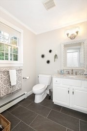 117 Perkins Row Topsfield, MA 01983 - Photo 6 of 25 a bathroom with a sink a toilet and a mirror