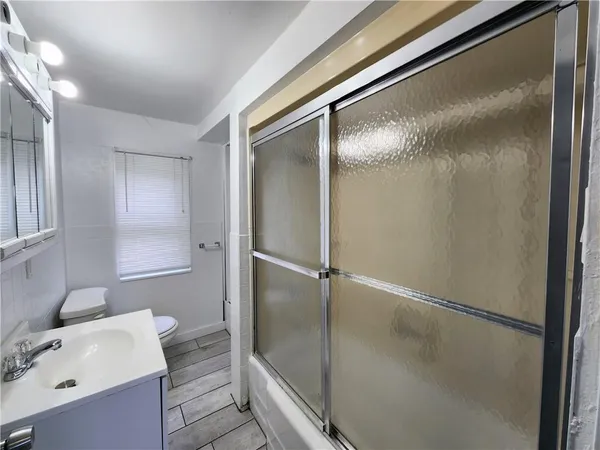 a bathroom with a tub and shower