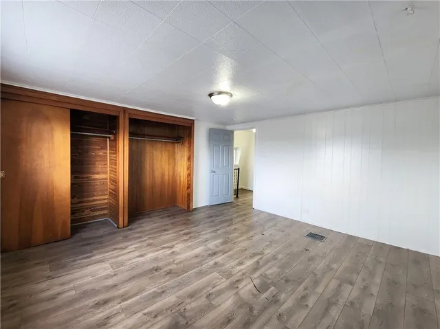 an empty room with closet area