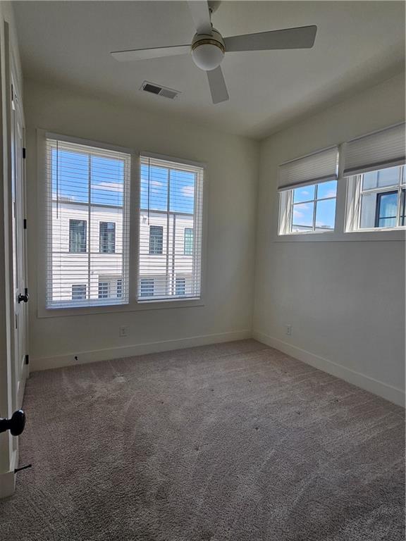 1294 Longreen Terrace Northwest, Unit 2 Atlanta, GA 30318 - Photo 18 of 25 an empty room with a window