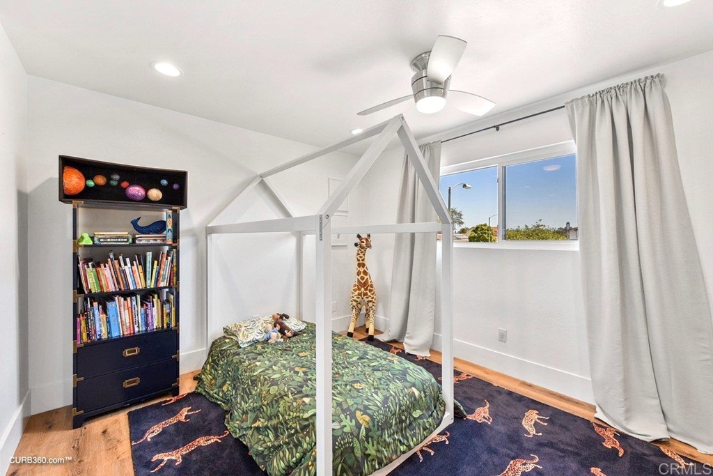 3815 Trieste Drive Carlsbad, CA 92010 - Photo 21 of 24 a living room with lots of furniture and a book shelf